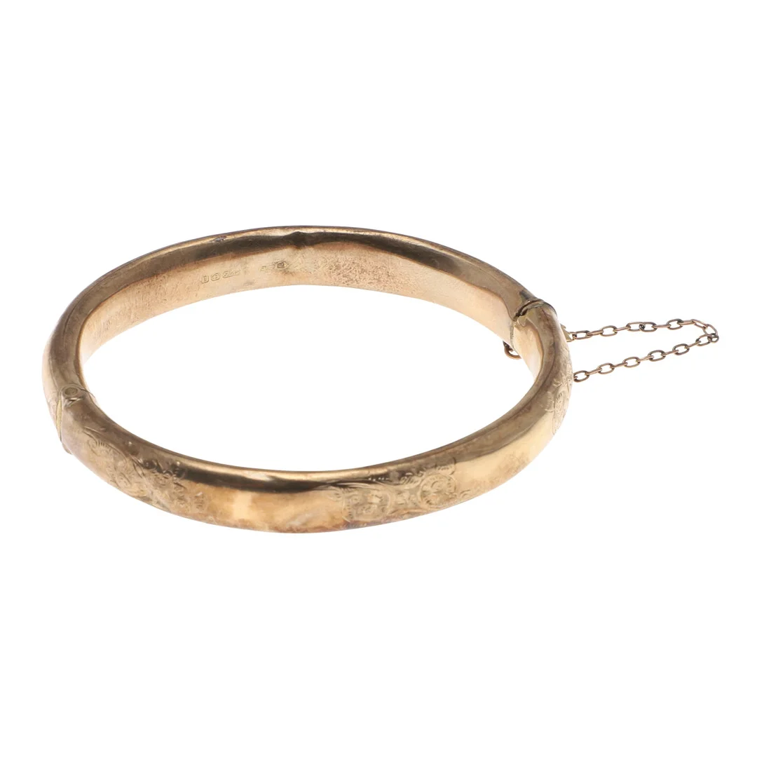 A 9CT GOLD HALF HINGED BANGLE. — Bracelets — Lawrences Auctioneers