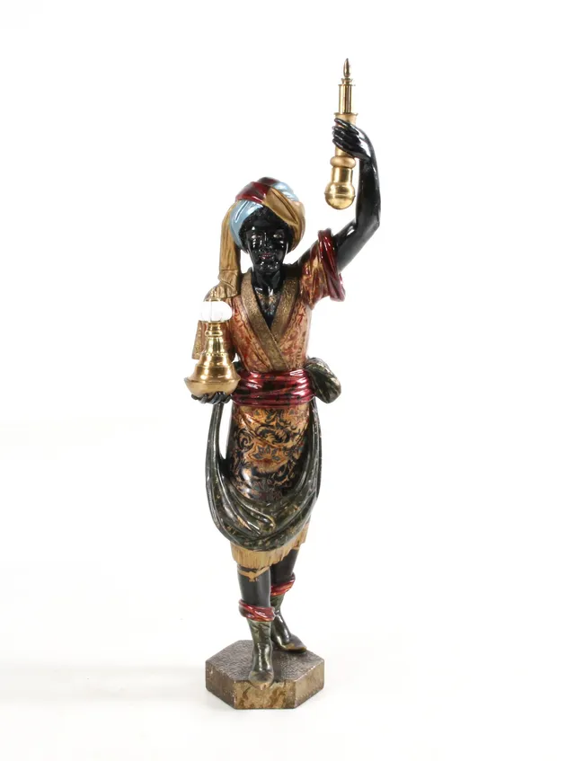 Large male figure made of painted wood.