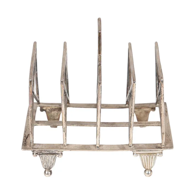 AN EDWARDIAN SILVER TOAST RACK.