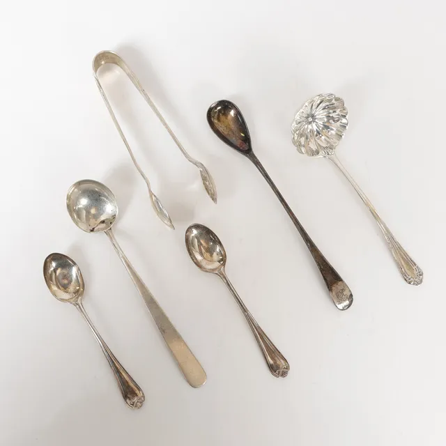 A COLLECTION OF SILVER SPOONS, A PAIR OF SUGAR TONGS (6).
