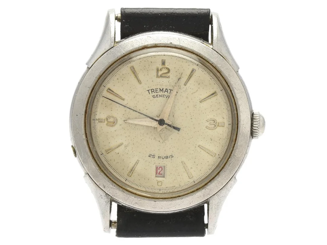 TREMATIC, Geneve, herrur, 36 mm, Boett nr. 40063/302, stål, manuell, plexiglas, datum, skadad urtavla, servicebehov, läderband, ca 1955. — Klockor/Övriga klockor — Kaplans