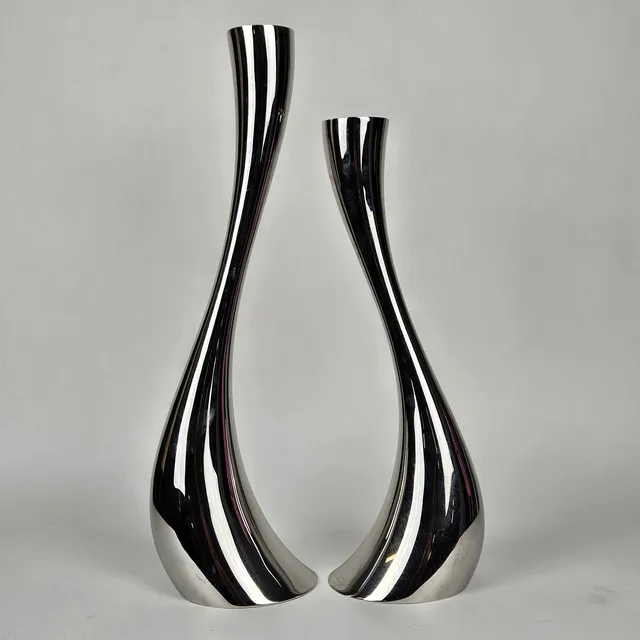 CONSTANTIN WORTMANN. Golvljusstakar, 2 st, rostfritt stål, "Cobra", Georg Jensen, Danmark.