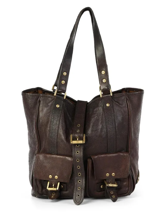 A “Roxanne” bag of dark brown leather with gold tone hardware, two handles, one compartment with a button closure, one interior zipped pocket and dark brown fabric lining. H. 31 x W. 27 x D. 14 cm.