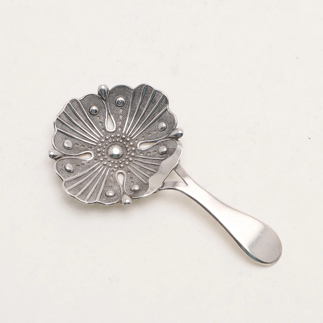 A GEORGE III CADDY SPOON. — Silver — Lawrences Auctioneers