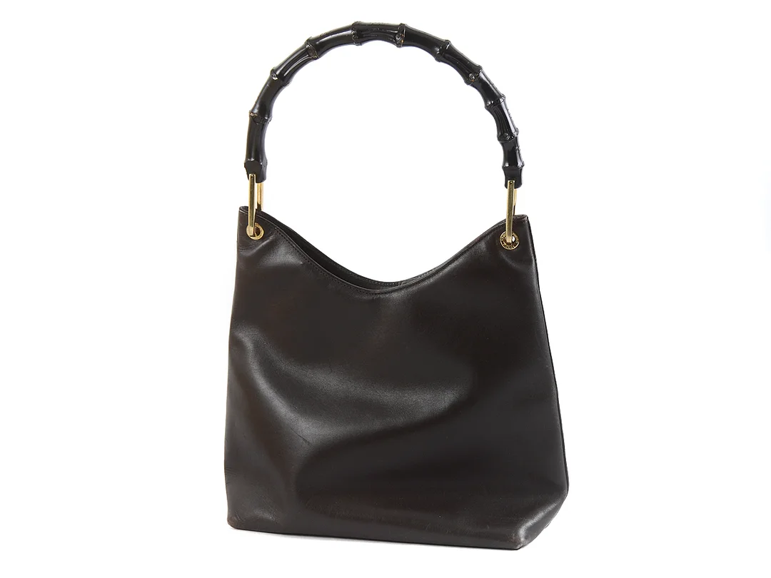 VÄSKA, GUCCI, vintage, brunt läder, bambuhandtag, 25x22x10 cm, visst slitage och repor. — Accessoarer/Väskor — Kaplans