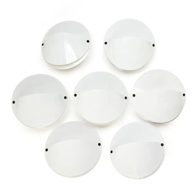 “Giovi”. Set of seven white lacquered metal wall lamps. Manufactured by FLOS. Diam. 27. (7)