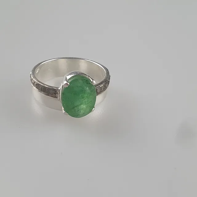- 5cts Oval Cut Emerald Ring with Rose Cut Diamonds.