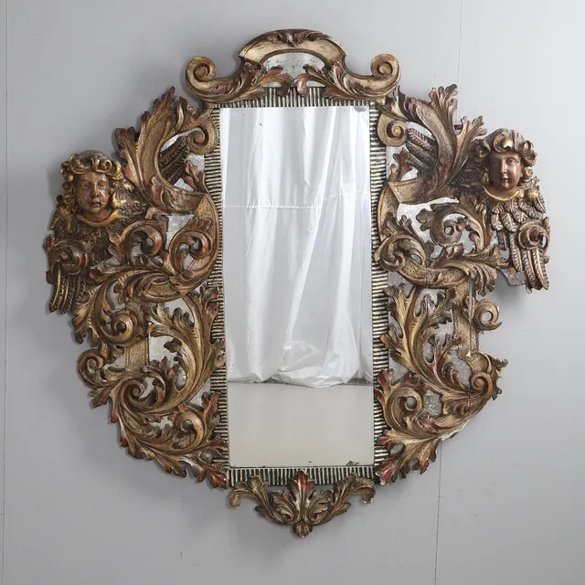 A 19TH CENTURY ITALIAN CARVED AND PAINTED WALL MIRROR.