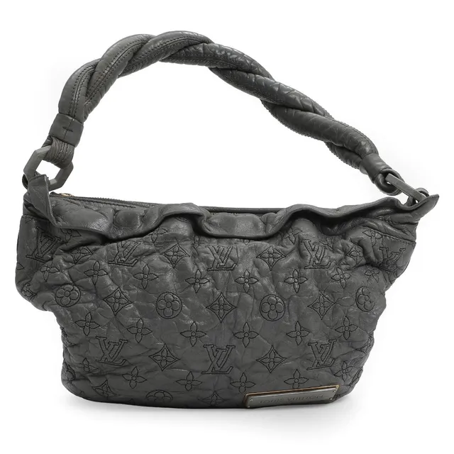 “Olympe Nimbus” of grey monogram leather with gold tone hardware, braided handle, one compartment with two pockets and grey lining. H. 24. W. 35. D. 7 cm. 2007.