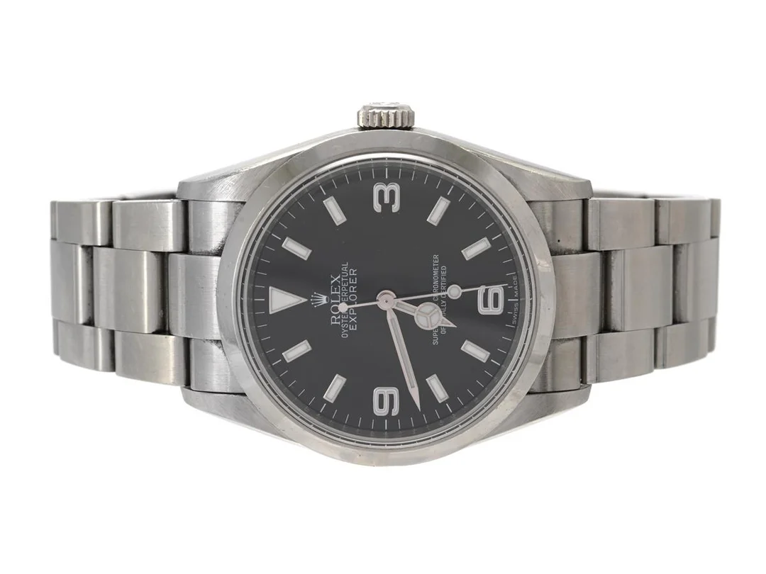 ROLEX, Oyster Perpetual, Explorer (Swiss Made), Chronometer, "Rehaut RRR", Ref nr. 114270, Serie nr. G071664, Cal 3130, Verk nr. 3 3353222, Boett nr. 2080, herrur, 36 mm, stål, automatisk, safirglas (nagg), Oysterlocklänk, viklås, Ref nr. 78690-RS8, cert, december 2010, box, ytterkartong. — Klockor/Rolex — Kaplans