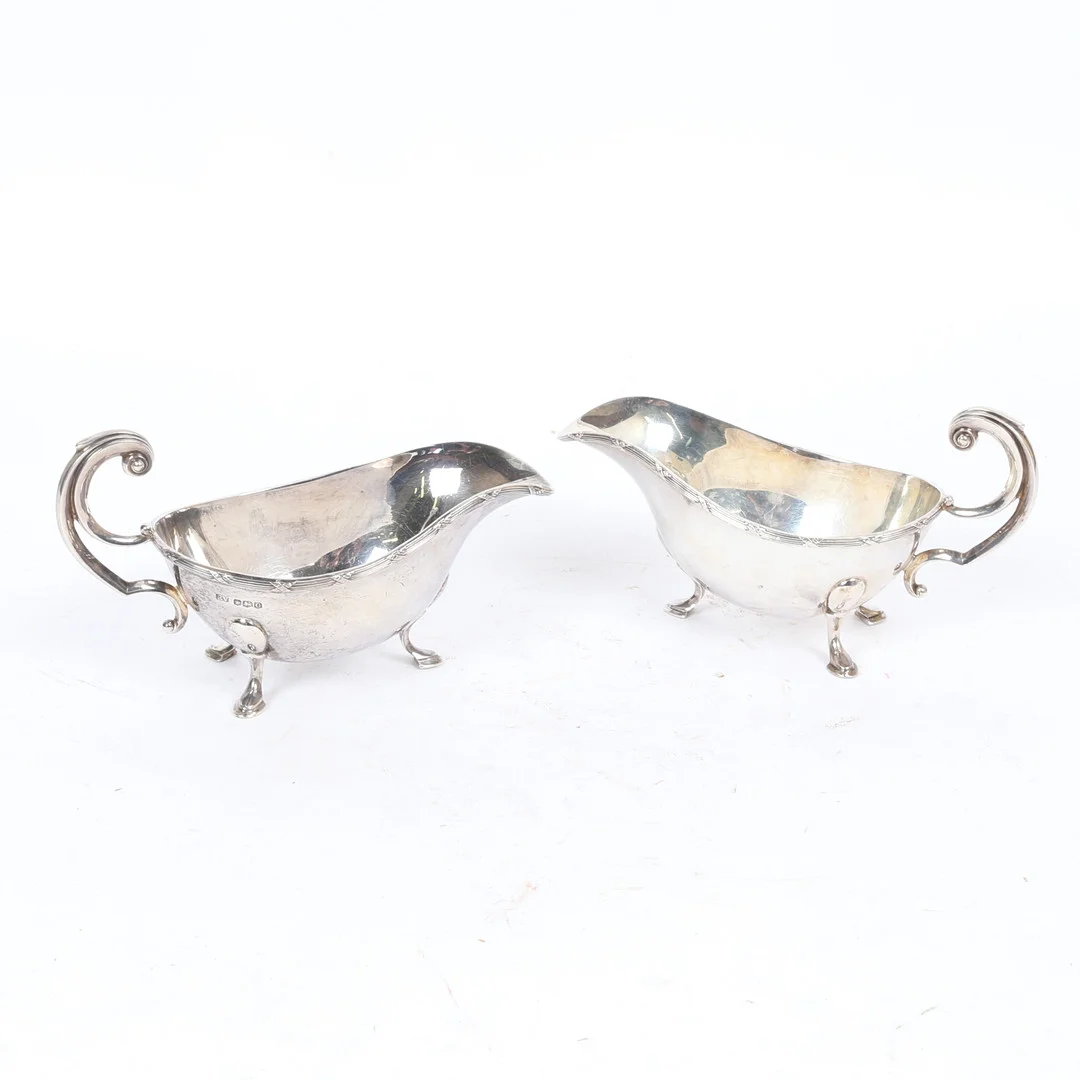 A PAIR OF GEORGE V SILVER SAUCEBOATS. — Silver — Bishop & Miller