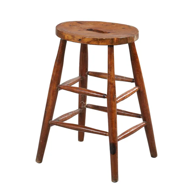 AN EARLY 20TH CENTURY YEW WOOD SEATED STOOL.