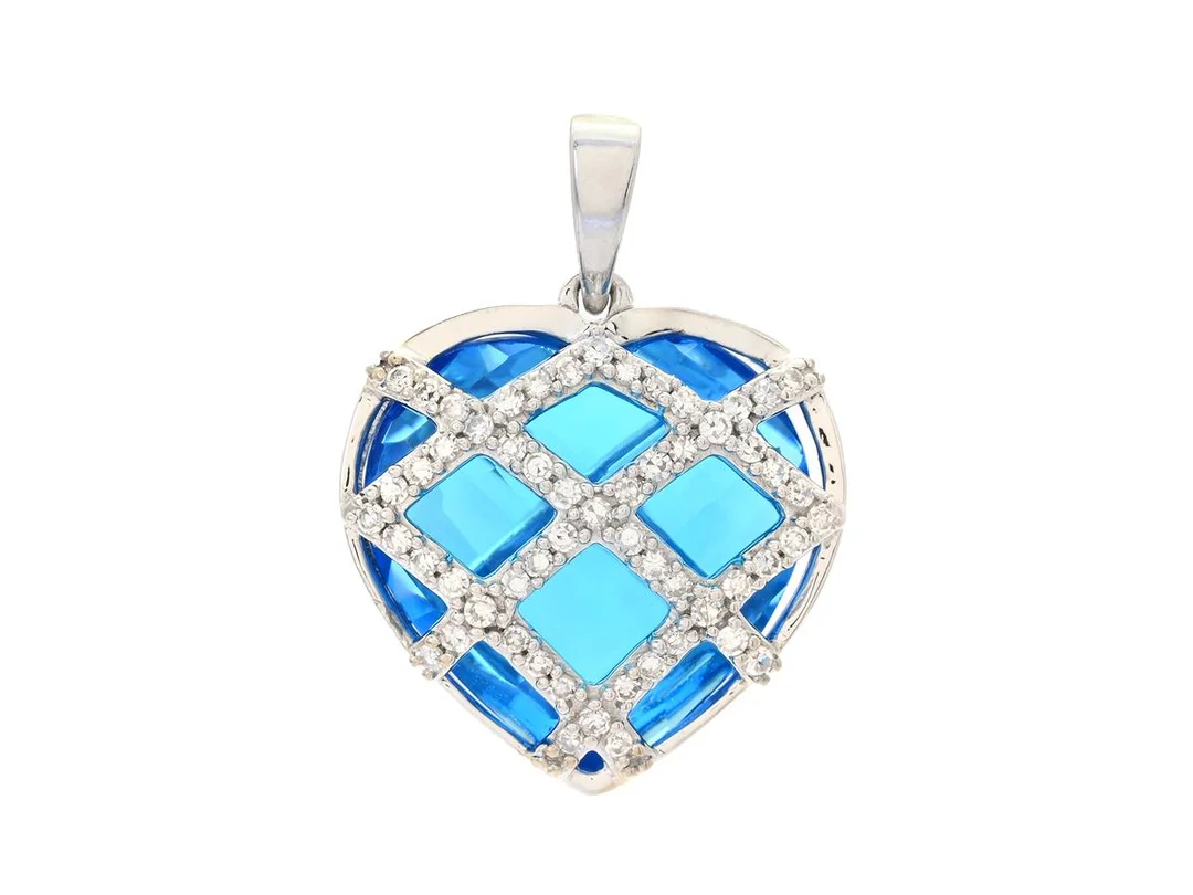 HÄNGE, Hjärta, 18K vitguld, blått glas, 60 åttkantslipade diamanter ca 0,20 ctv, höjd 17 mm, vikt 5,4 g, flera diamanter har nagg. — Smycken/Hänge — Kaplans