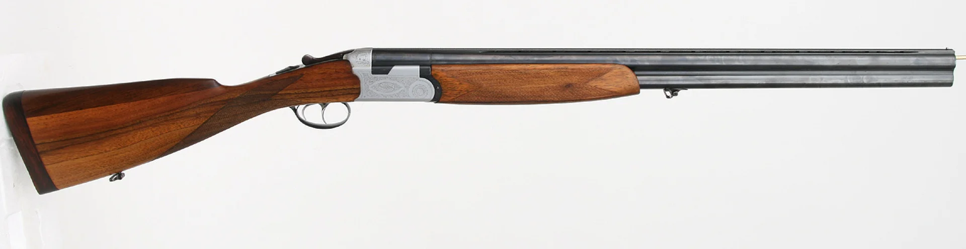 HAGELGEVÄR, italienskt, Bockhammerless, fabrikat Beretta, modell S56E, kaliber 12/70. — Shotguns — Mauritz Widforss