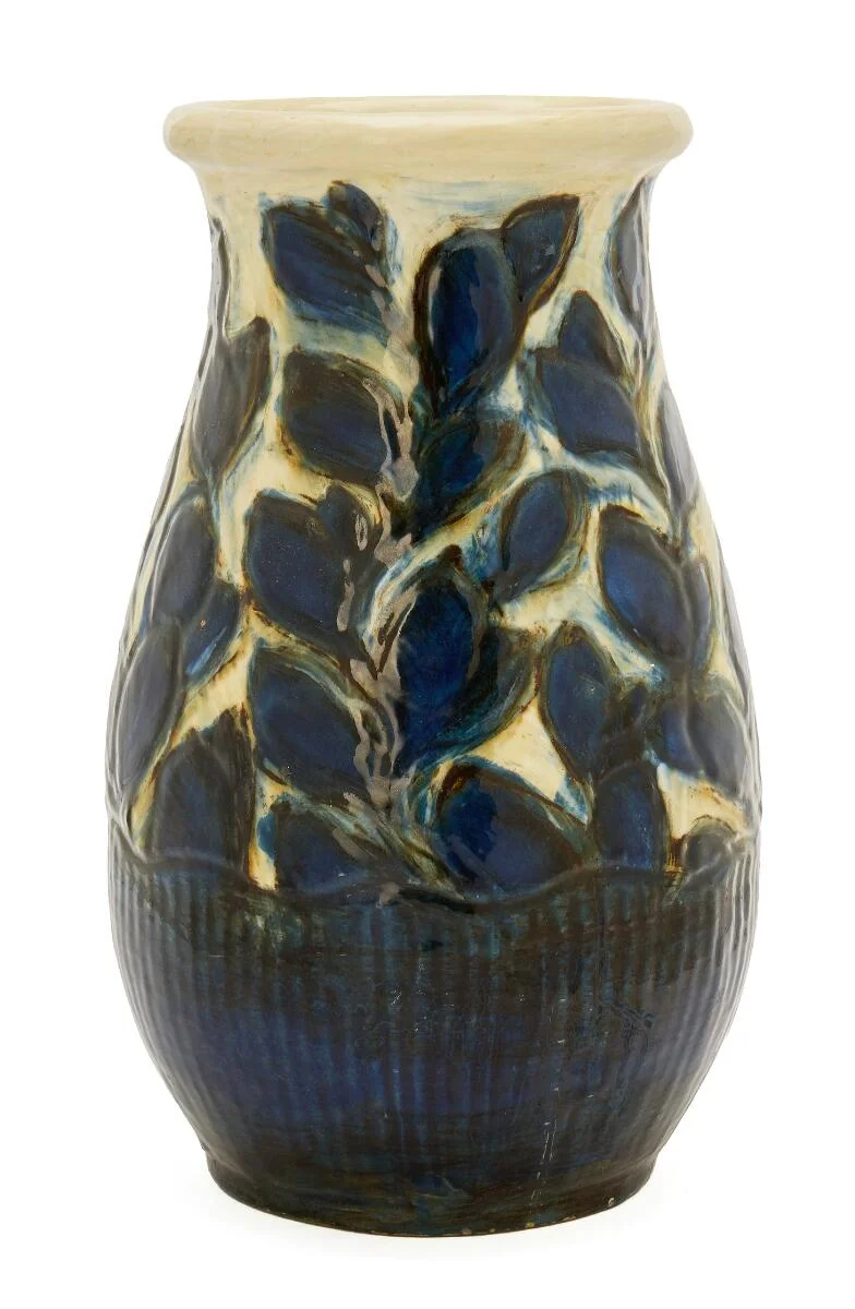 Earthenware vase modelled with leaves and linear relief decoration. Decorated with dark blue, brownish and cream-coloured glaze. Signed HAK. Made by Kähler. H. 28.5 cm. — Modern Decorative Art — Bruun Rasmussen