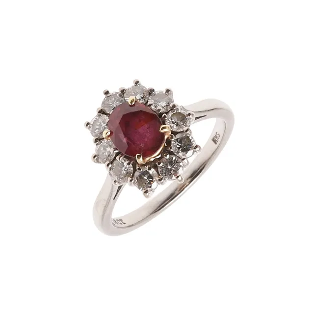 A RUBY AND DIAMOND CLUSTER RING.