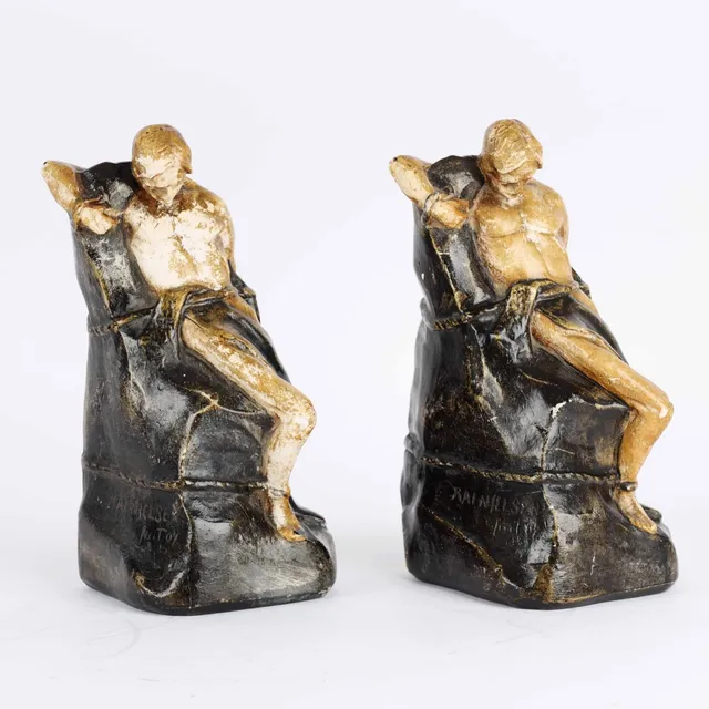 Kai Nielsen (1882-1924) : Seated youth. Two painted plaster bookends. 1904. (2)