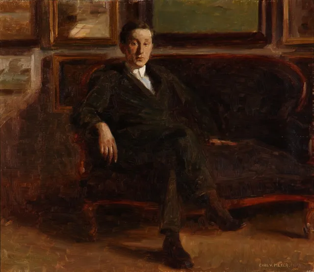 Carl V. Meyer. Portrait of a young man sitting in a living room, 1912