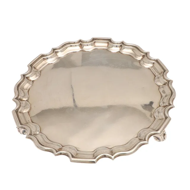 AN EDWARDIAN SILVER SALVER.