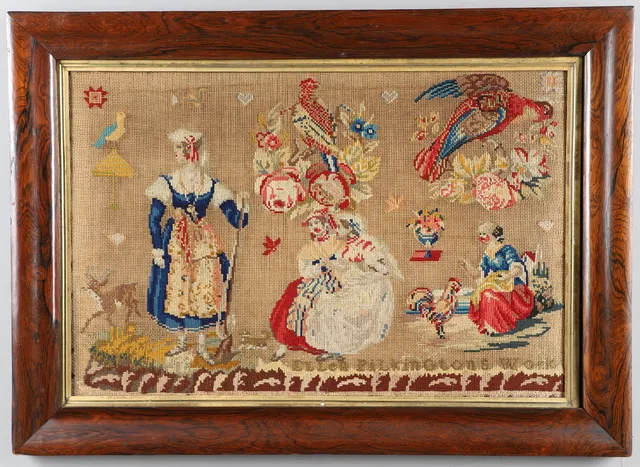 A ROSEWOOD FRAMED NEEDLEWORK PICTURE.