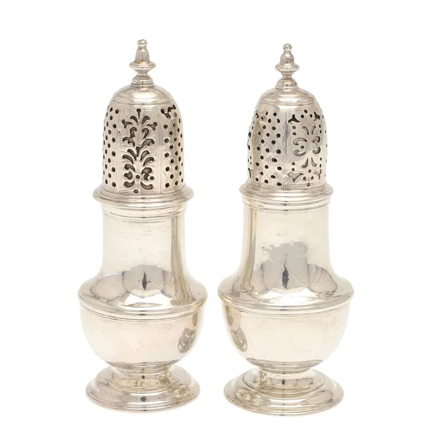 A NEAR PAIR OF GEORGE II SILVER PEPPER CASTERS.