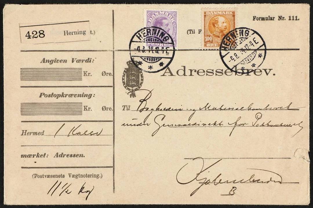 1905–1913. Christian IX. 100 Øre, yellow brown and Christian X. 15 Øre, violet. Parcelcover from HERNING 4.8.14 to Copenhagen. 100 Øre Christian is scarce on cover — Stamps, Covers & Postal History/Denmark/Bogtryk — Bruun Rasmussen