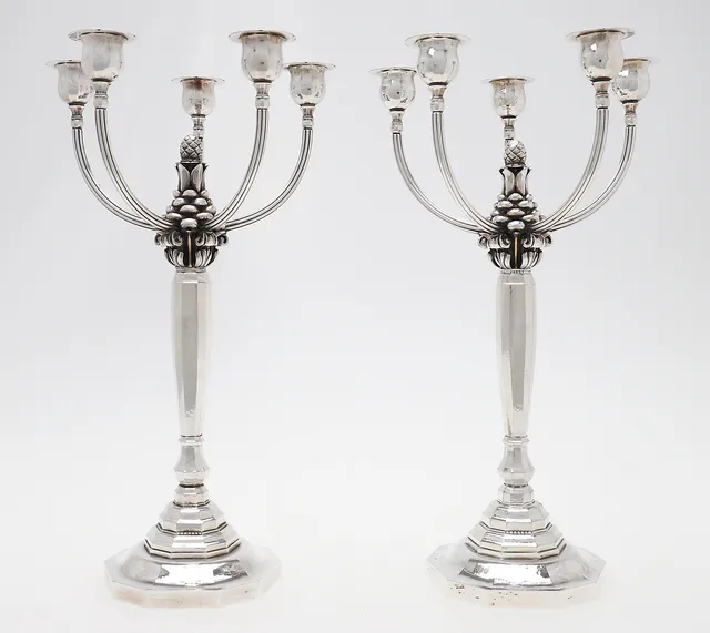 GEORG JENSEN. A PAIR OF DANISH SILVER FIVE-LIGHT CANDELABRA.