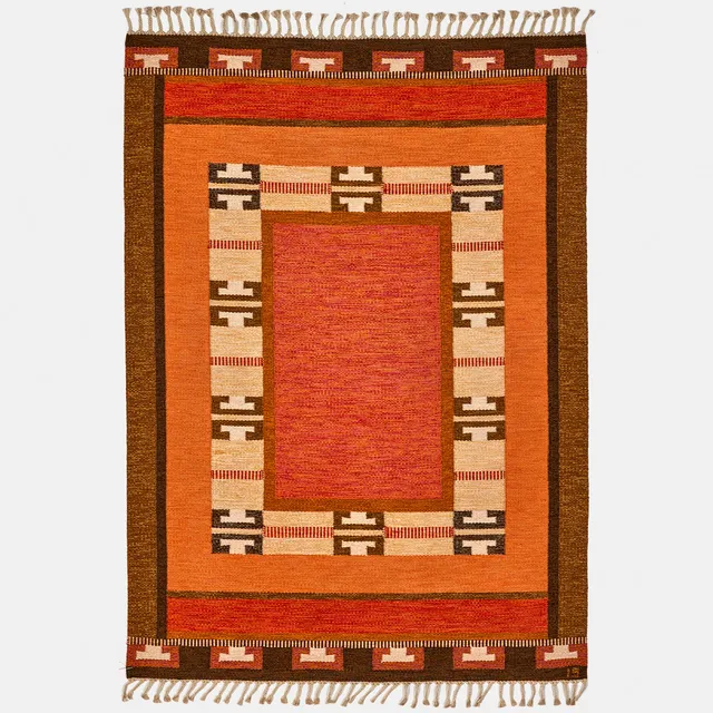 INGEGERD SILOW. A flatweave carpet, decorated in orange, red and brown hues, signed IS.