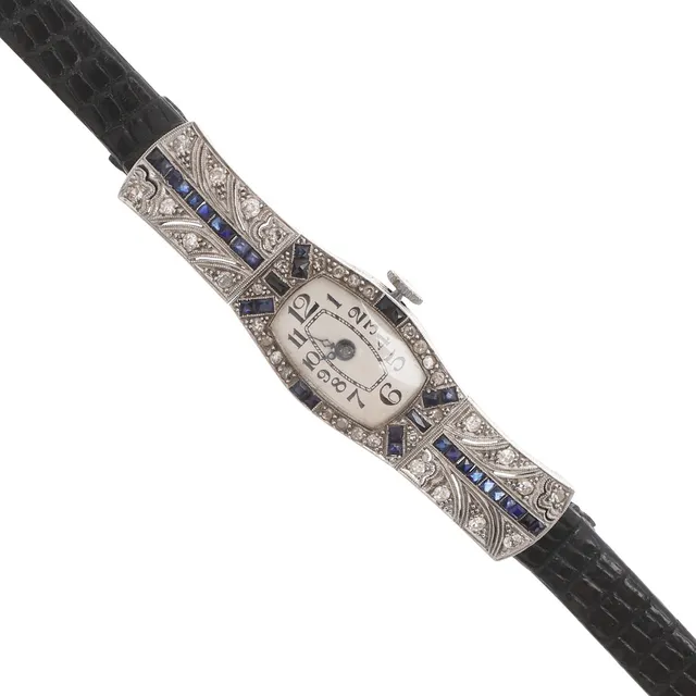 AN ART DECO LADY'S SAPPHIRE AND DIAMOND COCKTAIL WRISTWATCH.