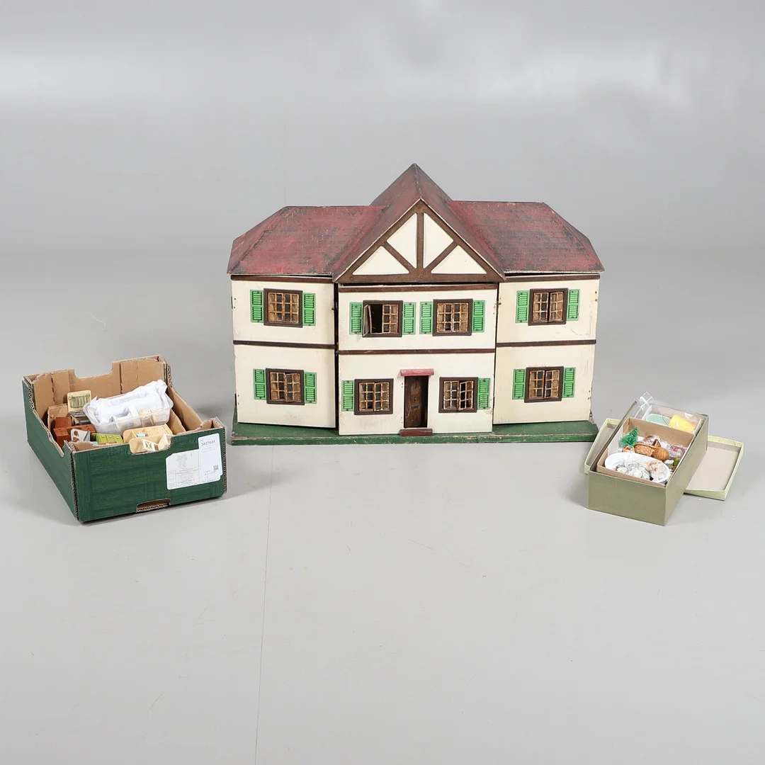A VINTAGE DOLLS HOUSE. — Toys — Lawrences Auctioneers