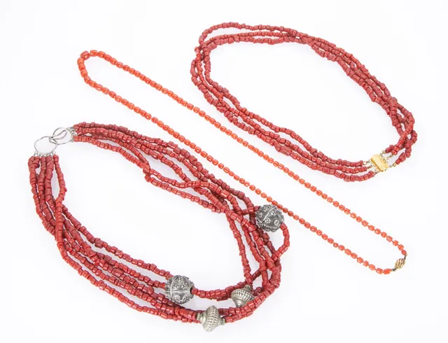 Three coral necklaces. (3)