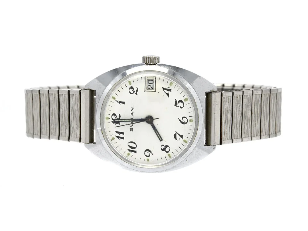 SVALAN, herrur, 32 mm, vitmetall, manuell, plexiglas, datum, ca 1970, metallänk ej originallänk. — Klockor/Svalan — Kaplans