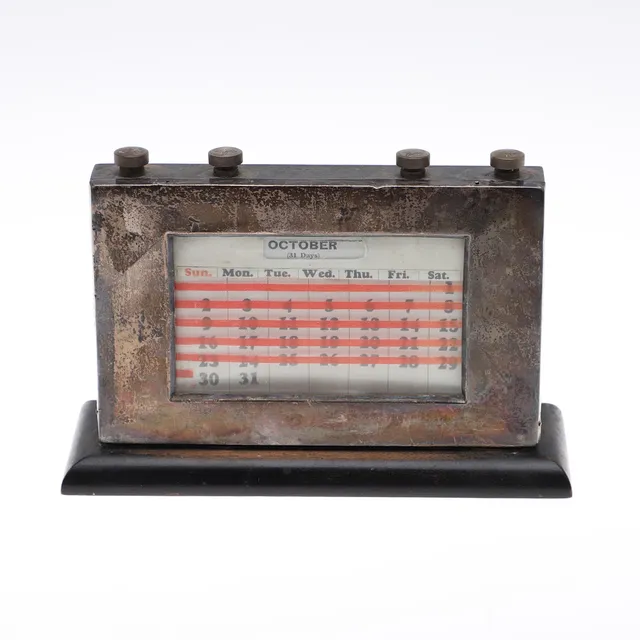 A SILVER PERPETUAL CALENDER.