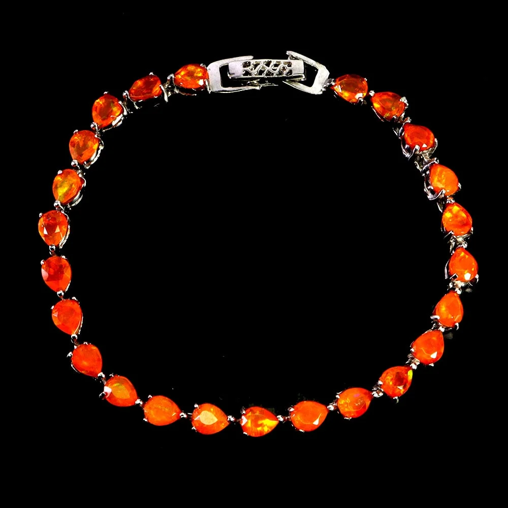 Opal bracelet in rhodium-plated Sterling silver with numerous, faceted transparent orange fire opals — Jewellery/Bracelets — Lauritz