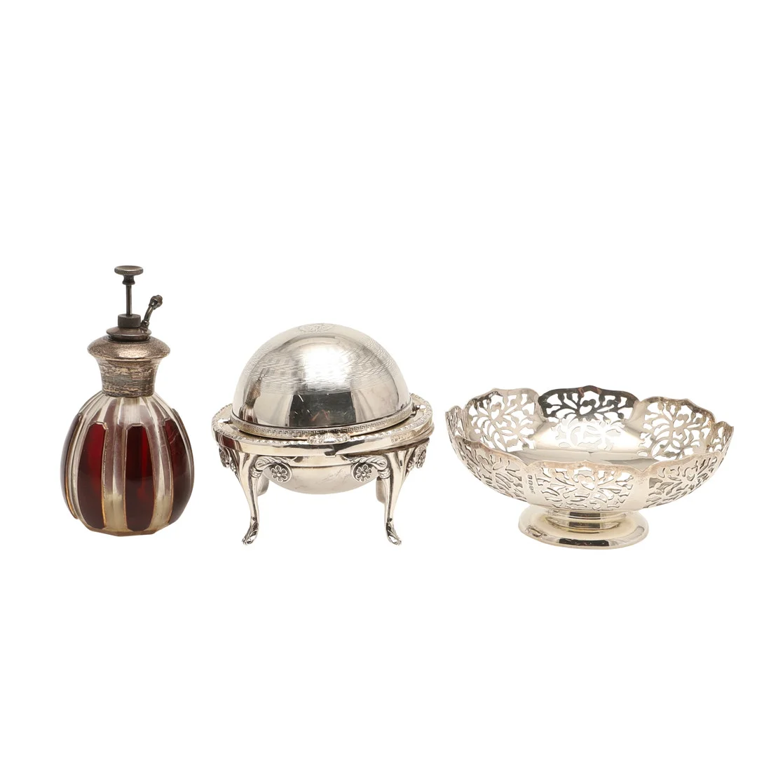 AN EARLY 20TH CENTURY SILVER MOUNTED ATOMISER, AN EDWARDIAN SILVER PLATED ROLL-TOP CAVIAR DISH, AND AN EDWARDIAN SILVER PLATED BONBON DISH. — Silver — Lawrences Auctioneers