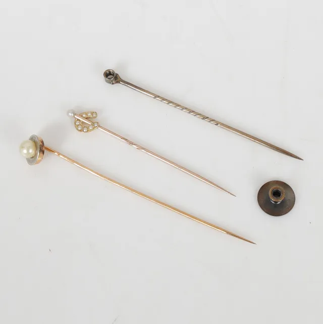 Three stick pins (3).