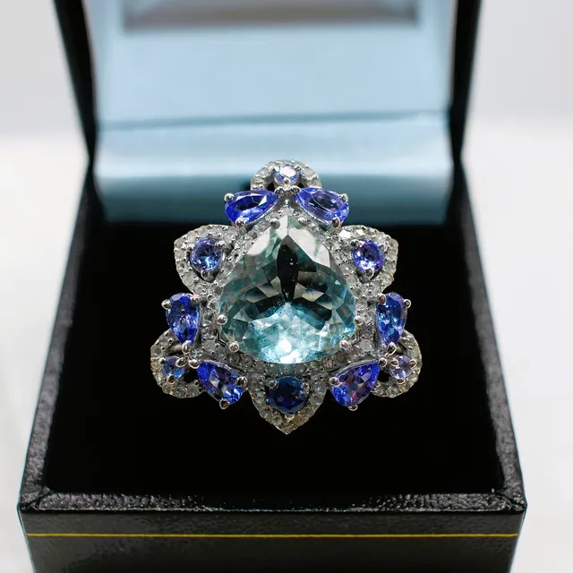 AQUAMARINE, TANZANITE, KYANITE & DIAMOND RING.