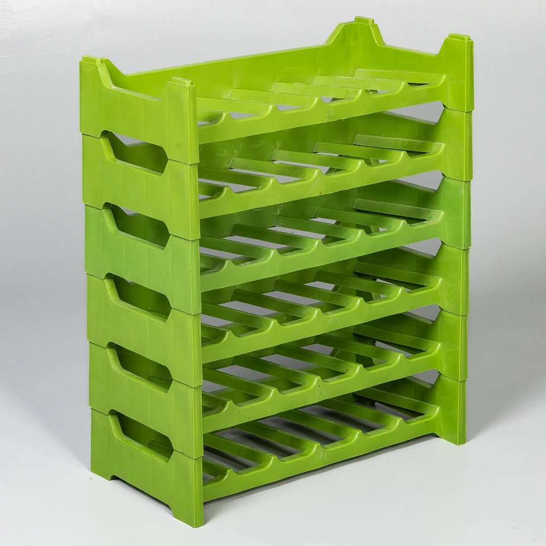 FRENCH MID-CENTURY GREEN PLASTIC MODULAR WINE RACK. — Cupboards, Cabinets & Shelves — Griffin’s Auctioneers