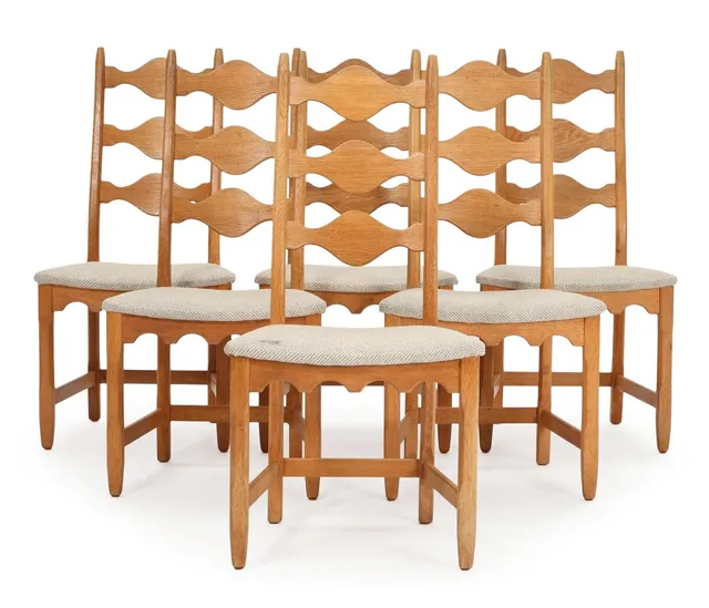 A set of six solid oak chairs, upholstered in seats with light wool. Manufactured by Stolefabrikken Lindebjerg. 1970s. (6)