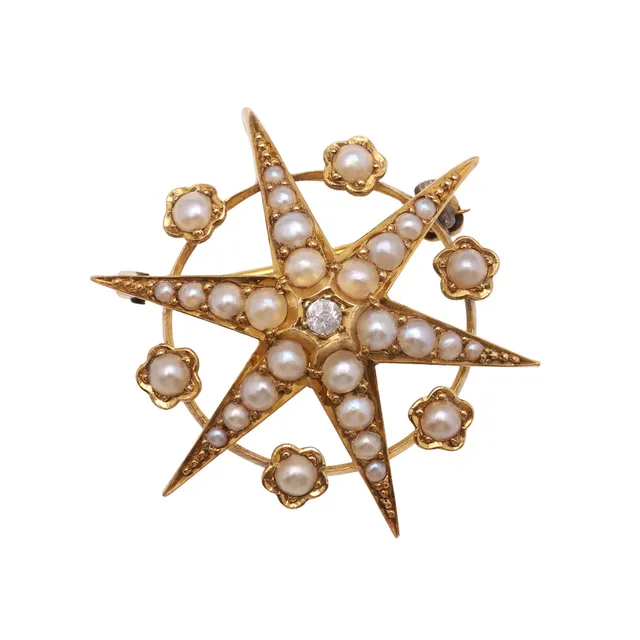 A LATE VICTORIAN PEARL AND DIAMOND SET STAR PENDANT BROOCH.
