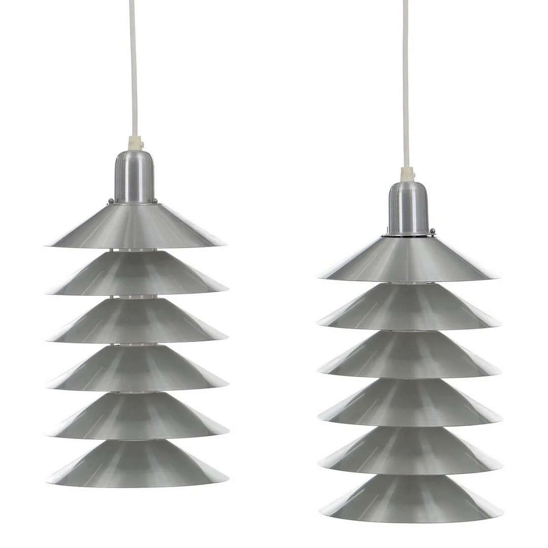 “Tip Top”. A pair of brushed-steel pendants with white lacquered insides. Manufactured by Pandul. H. 25. Diam. 20 cm. (2) — Modern Lighting — Bruun Rasmussen