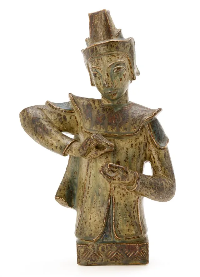 A large stoneware figure. Decorated with Sung glaze. Signed monogram. Royal Copenhagen. H. 46 cm. W. 30 cm. D. 14 cm.