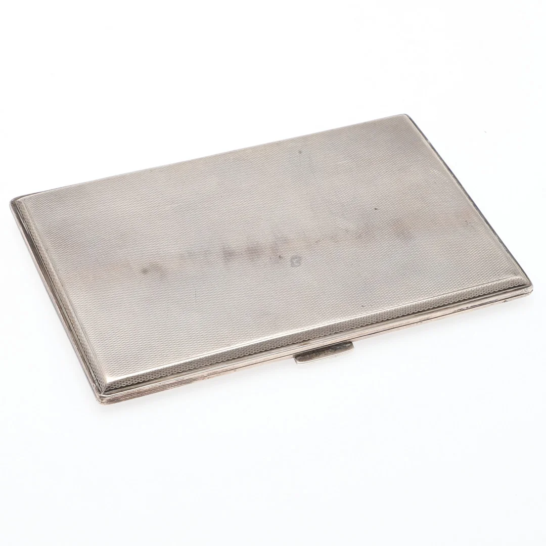 A GEORGE V SILVER CIGARETTE CASE. — Silver — Lawrences Auctioneers