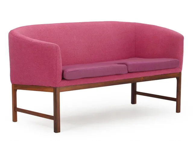 Two seater sofa with rosewood frame, upholstered with rose wool and fabric. Model V 16. Manufactured by Holger Christiansen. 1960s. L. 150 cm.