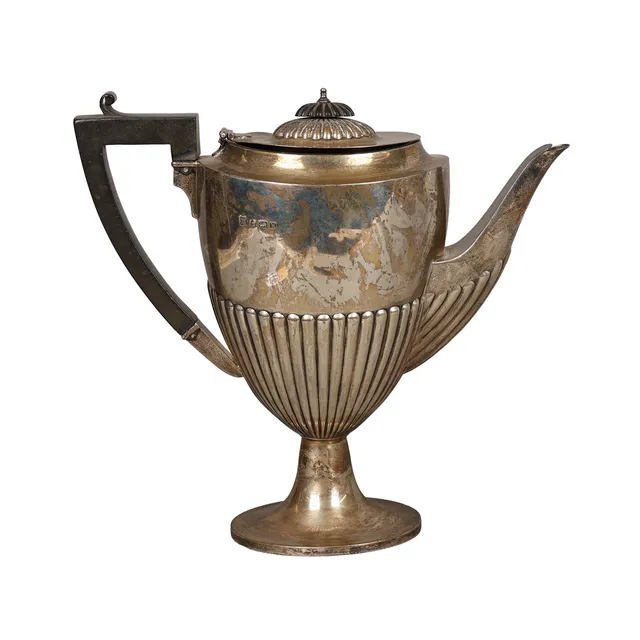 A GEORGE V SILVER COFFEE POT.