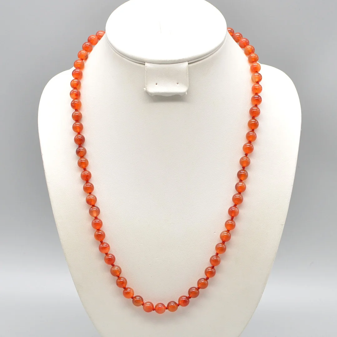 KARNEOL-PERLENCOLLIER, POLIERTE PERLEN, EINZELN GEKNÜPFT, UM 1950, CA. 61 CM. — Necklace — Kunst- und Auktionshaus Kleinhenz