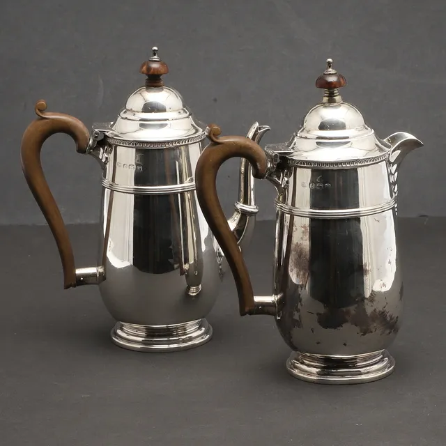 AN EARLY 20TH CENTURY SILVER CAFE AU LAIT PAIR.