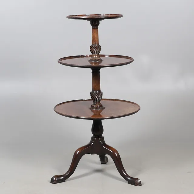 A MAHOGANY THREE TIER DUMB WAITER.
