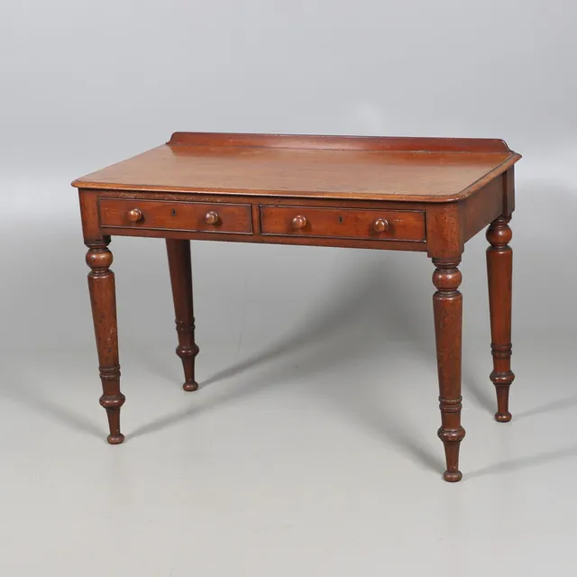 A VICTORIAN MAHOGANY TWO DRAWER SIDE TABLE.