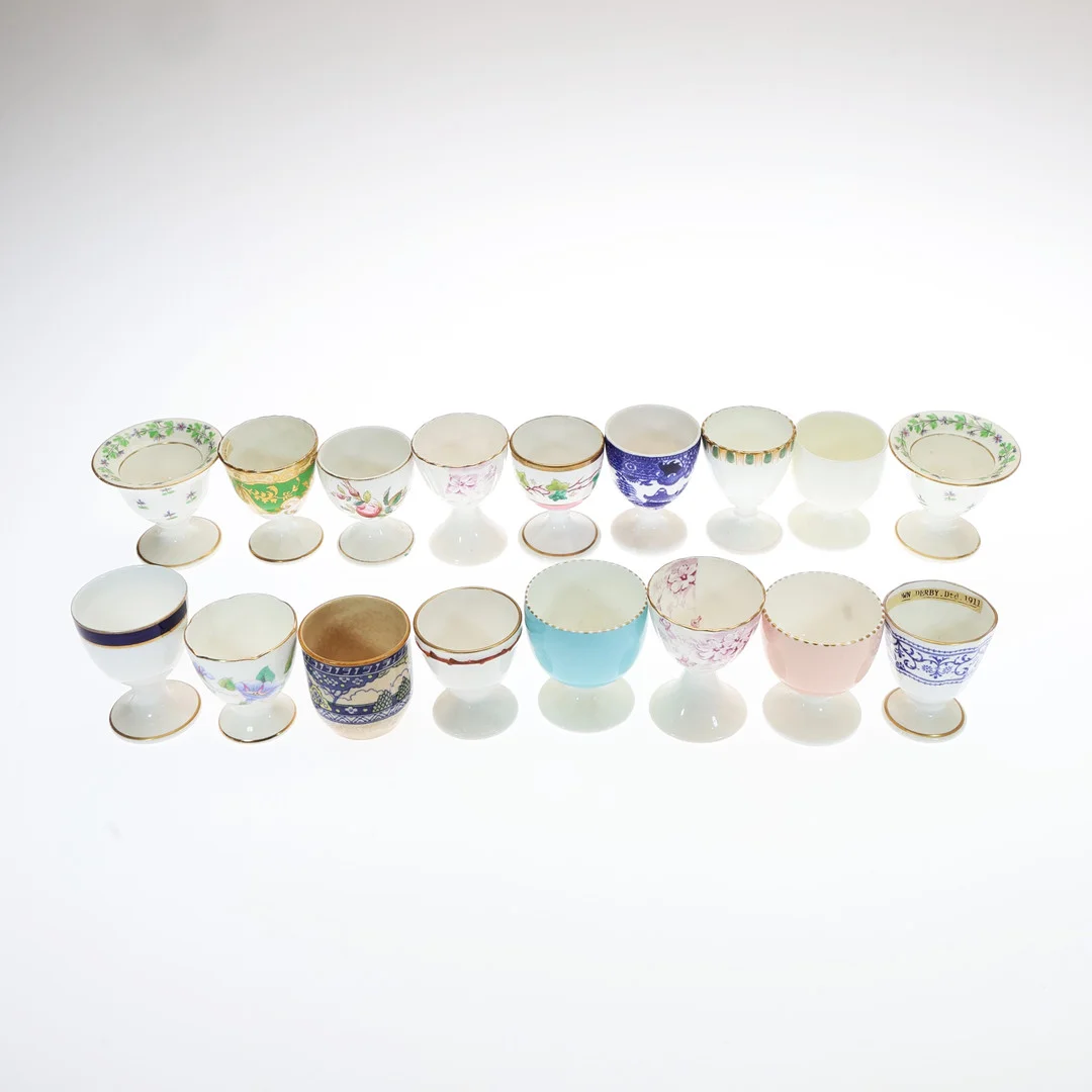 COLLECTION OF CERAMIC AND PORCELAIN EGGCUPS. (17). — European — Young's Auctions